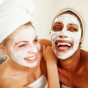 Two Lovely Ladies With Facial Cream