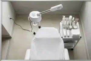 A serene facial treatment room featuring skincare products and equipment to promote relaxation and stress relief.